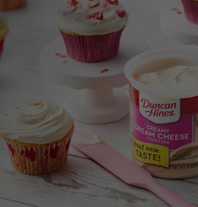 Duncan Hines Creamy Cream Cheese Frosting and cupcakes
