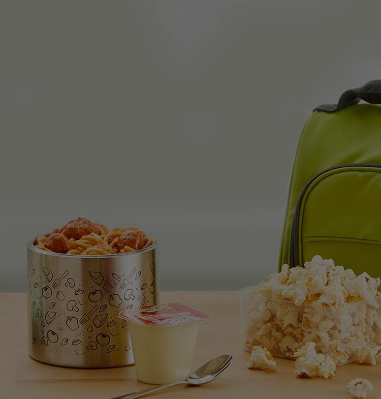 Snack Pack, popcorn pouch, and backpack on a table